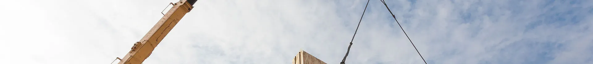 Crane installing structural panels